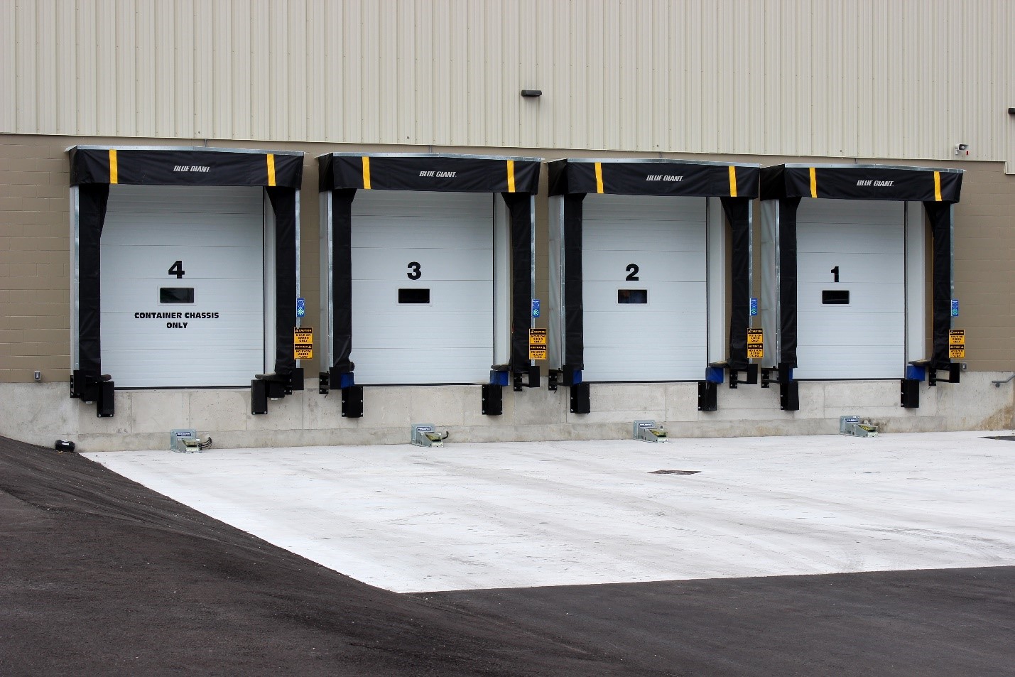 A row of doors in front of a building.